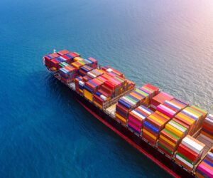 Aerial view of container cargo ship in sea.